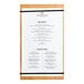 An American Metalcraft bamboo wood menu holder with a black rubberband holding a menu.