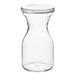 A clear polycarbonate carafe with a white lid.