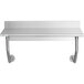 A Regency stainless steel wall mounted table with a shelf and backsplash.