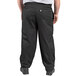 A person wearing Uncommon Chef black pants.