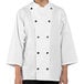 A person wearing a white Uncommon Chef 3/4 Length Sleeve Chef Coat with buttons and a collar.