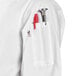A white Uncommon Chef 3/4 Length Sleeve Chef Coat with a red pen in the pocket.