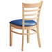 A Lancaster Table & Seating wooden chair with a navy blue cushion.