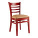 A Lancaster Table & Seating mahogany wood ladder back chair with a light brown vinyl seat.