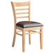 A Lancaster Table & Seating wood ladder back chair with dark brown vinyl seat.