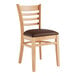 A Lancaster Table & Seating wooden restaurant chair with a dark brown vinyl cushion.