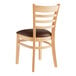A Lancaster Table & Seating wooden restaurant chair with dark brown vinyl seat.