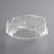 A clear plastic Choice pie container with a wavy edge and a lid.