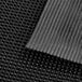 A close-up of a black rubber Choice anti-fatigue mat.