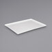 A white rectangular tray on a gray surface.