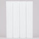 Four white plastic Wilton cake pillars.