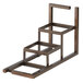 A bronze metal 3 step jar display shelf.