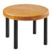 A Cal-Mil Madera rustic pine round wood riser on a round wooden table with black legs.