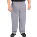 A person wearing Uncommon Chef houndstooth chef pants.