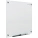 A white Quartet wall-mounted magnetic glass dry erase board.