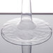 A close-up of a Fineline clear plastic martini glass with a clear stem.