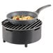 A Cal-Mil round chafer alternative pan with food in it on a table.