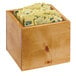 A Cal-Mil Madera wood box with yellow packets in it.