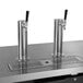 A Continental Refrigerator black double tap beer dispenser on a counter.