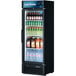 A Turbo Air black refrigerated merchandiser with drinks on shelves.