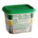 A container of Knorr Seafood Bouillon Base with a green lid.