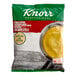 A bag of Knorr low sodium chicken gravy mix on a white background.