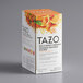 A white box of Tazo Wild Sweet Orange Tea Bags with oranges on it.