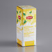 A yellow and white box of Lipton Lemon Herbal Tea Bags with white text and yellow flowers.