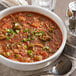 A bowl of Knorr Chicken Gumbo soup with rice and vegetables.