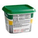 A plastic container of Knorr Ultimate Low Sodium Chicken Bouillon Base with a green lid.