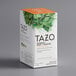 A white box of Tazo Refresh Mint Herbal Tea Bags with green leaves on it.