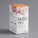 A white Tazo tea box with flowers on it.