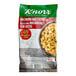 A bag of Knorr macaroni and cheese mix on a white surface.