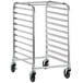 A silver metal Regency sheet pan rack with black wheels.