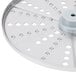A circular metal Robot Coupe hard cheese grating disc with holes.