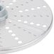 A Robot Coupe hard cheese grating disc, a circular metal object with holes.