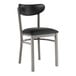 A black metal Lancaster Table & Seating chair with black vinyl seat and back.