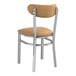 A Lancaster Table & Seating Boomerang chair with light brown vinyl seat and back.