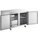 An Avantco stainless steel undercounter refrigerator with two doors open.