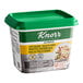 A container of Knorr Low Sodium Chicken Bouillon Base with a green lid.