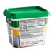 A container of Knorr Low Sodium Chicken Bouillon Base with a green lid.