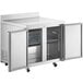 An Avantco stainless steel worktop freezer with two doors open.