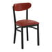 A black chair with a burgundy vinyl seat and backrest.