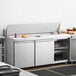 An Avantco stainless steel refrigerator on a kitchen counter.