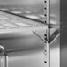 A stainless steel shelf in an Avantco undercounter freezer.