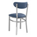 A blue Lancaster Table & Seating chair with silver metal legs and a navy vinyl seat and back.