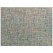 A close up of a taffy twill woven vinyl rectangle placemat with a multicolored pattern.