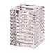 A Hollowick clear glass square candle holder with a lit candle inside.