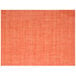 A close-up of the Front of the House Metroweave apricot mesh woven vinyl placemat with an orange and white woven pattern.