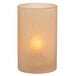 A Wysp Amber Satin Glass Cylinder Candle Holder with a lit candle on a white surface